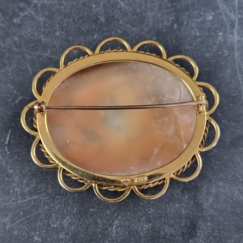 208 - A carved shell cameo brooch, in a yellow metal mount, stamped '9ct', the outer frame 61 x 51mm.... 