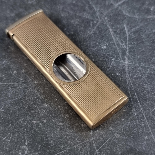 213 - An engine turned 9ct gold cigar cutter, by W M Ltd, Birmingham 1965, 5.3cm closed, gross weight 12.2... 