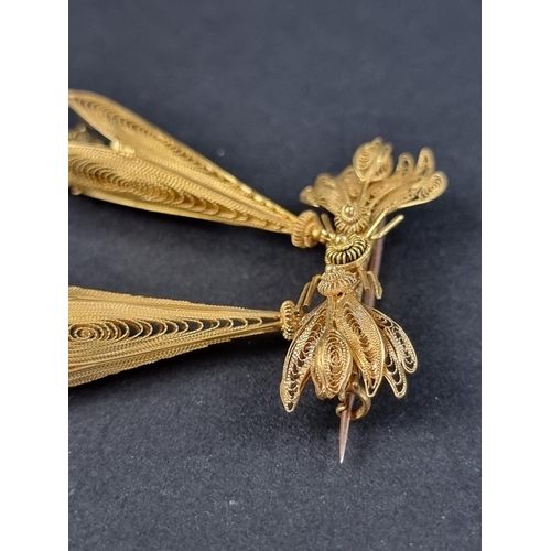 215A - A Victorian gilt metal filigree insect brooch, with two pendant drops, 37mm wide x 60mm high.... 