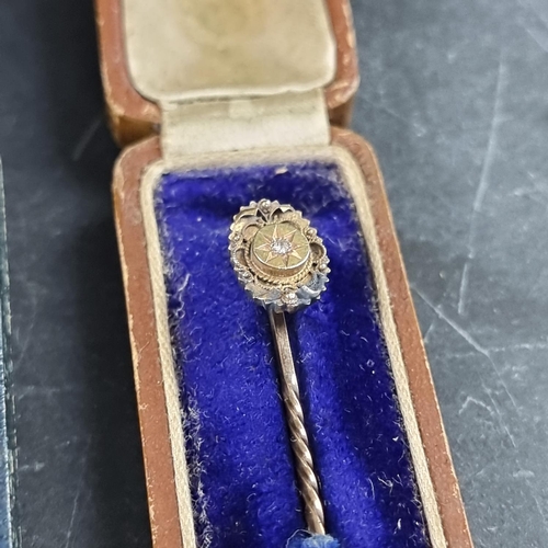 220 - A yellow metal stick pin, set old cut diamond, 6cm; together with another diamond set stick pin; and... 