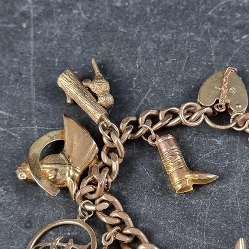 222 - A 9ct gold curb link bracelet, having padlock clasp, with thirteen attached gold charms, 50.7g.... 