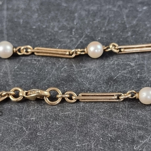 224 - A yellow metal and pearl set necklace, with clasp stamped 9ct, set with 22 pearls, 82cm long.... 