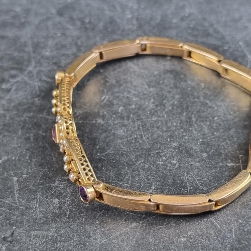 225 - An Edwardian yellow metal amethyst and seed pearl expanding bracelet, stamped '15ct', approximately ... 