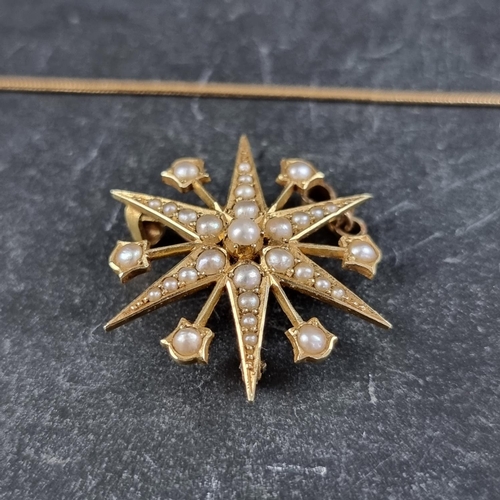 227 - A Victorian starburst pendant/brooch, set split pearls, stamped 15ct, 29mm diameter, with an 18ct go... 