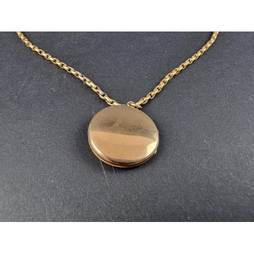 230A - A 9ct gold locket, 25mm, on yellow metal chain stamped 9ct, 43cm.