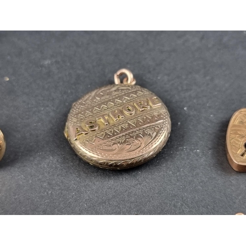 241A - A yellow metal locket, inscribed 'Asthore' (Gaelic for treasure), 24mm diameter; together with a pad... 