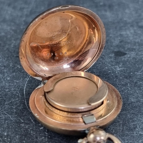 242 - A late 19th/early 20th century gold plated sovereign case, 34mm diameter, by Dennison, on a chain, 4... 