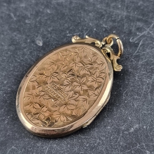 246 - A yellow metal front and back locket, stamped 9ct gold, 30mm high, on yellow metal chain link neckla... 