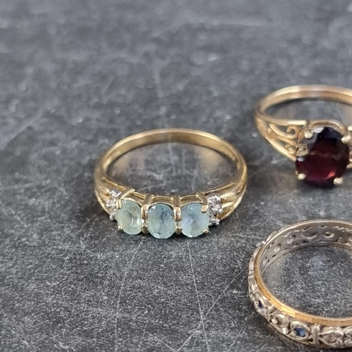 247 - Three 9ct gold gem set rings; together with a similar yellow metal gem set ring. (4)... 