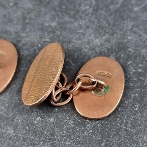 249 - A pair of 9ct gold engine turned cufflinks, 10g.