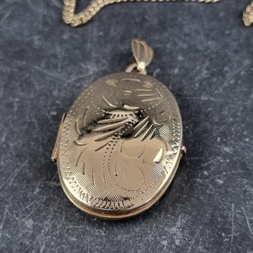 251 - A yellow metal chain, stamped 375, 47cm, with attached locket.