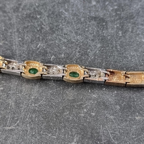 252 - A yellow metal bracelet, set five emeralds interspersed with eighteen small diamonds, 18ch long.... 