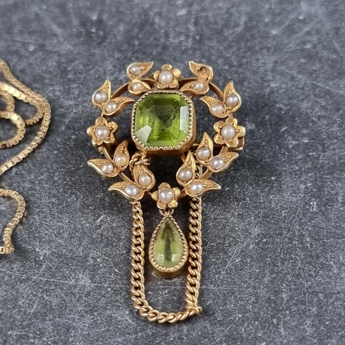 267 - An Edwardian yellow metal wreath brooch, set central octagonal facetted peridot, surrounded by seed ... 