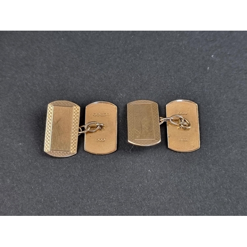 267A - A pair of 9ct gold engine turned cufflinks, Birmingham 1950, 3.3g.