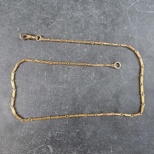 275 - A yellow metal watch chain, with attached gold plated Albert clasp, 37cm long excluding clasp.... 