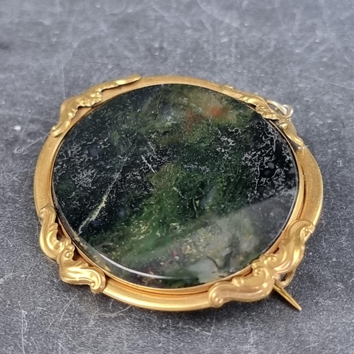 278 - A moss agate brooch, in a gilt metal frame, 55mm long.