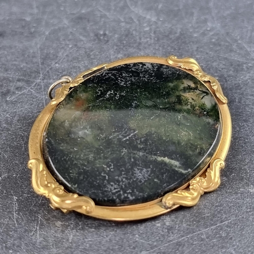 278 - A moss agate brooch, in a gilt metal frame, 55mm long.