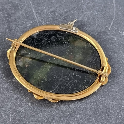 278 - A moss agate brooch, in a gilt metal frame, 55mm long.