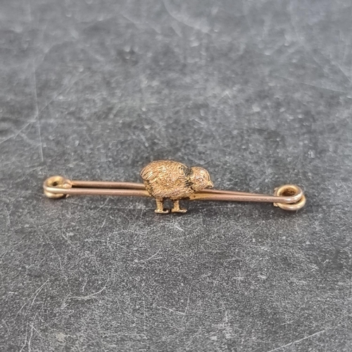 280 - A yellow metal 'chick' bar brooch, stamped '9ct', 42mm wide.