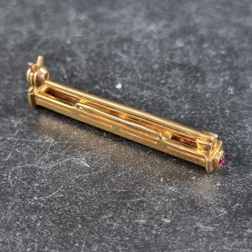 284 - An 18ct gold bar brooch, channel set with eleven rubies and four brilliant cut diamonds, with additi... 