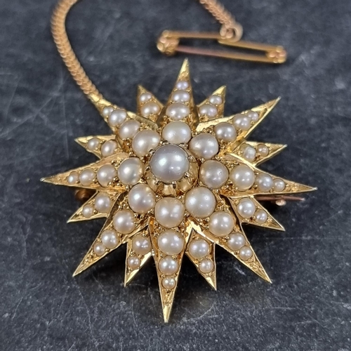 285 - A Victorian yellow metal starburst brooch, set split pearls, 34mm diameter.