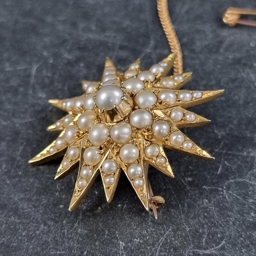 285 - A Victorian yellow metal starburst brooch, set split pearls, 34mm diameter.