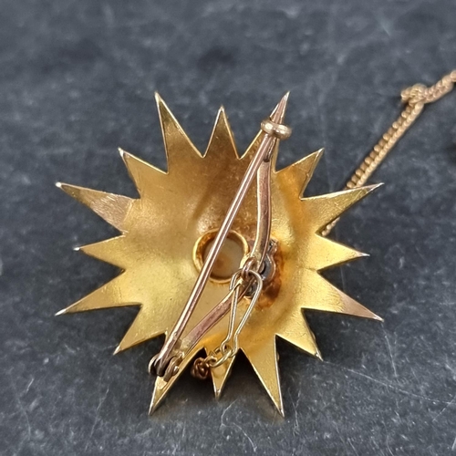 285 - A Victorian yellow metal starburst brooch, set split pearls, 34mm diameter.