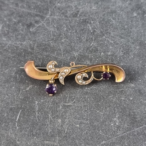 289 - A yellow metal scroll floral bar brooch, set two amethysts and twelve split pearls, stamped '9ct', 4... 