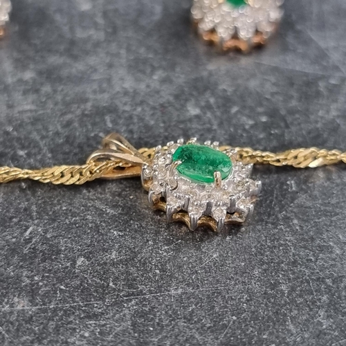 294 - A yellow metal pendant, set central emerald surrounded by diamonds, stamped 14k, 13mm high, on an It... 