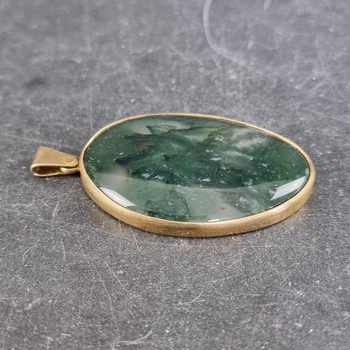 297 - A gilt metal moss agate pendant, 52mm high including bale.