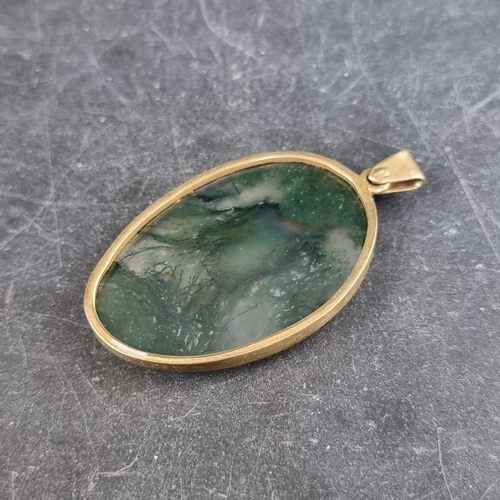 297 - A gilt metal moss agate pendant, 52mm high including bale.