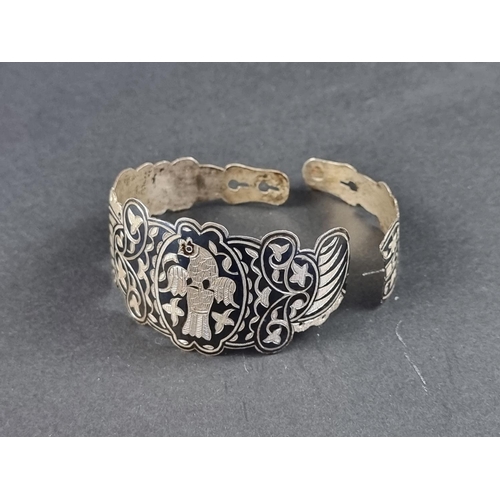 302 - A cased Russian Imperial silver niello bangle, stamped 84 1854, decorated with a bird and initials t... 