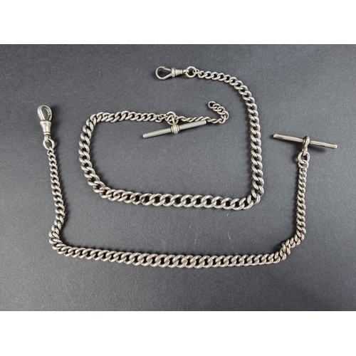 306 - A silver curb link Albert chain, 36cm; together with another example, 29cm. (2)