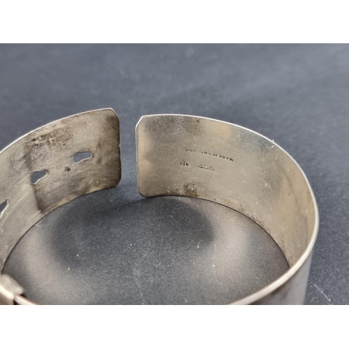 308 - An engine turned white metal adjustable cuff bracelet, by Joseph Smith & Sons (Birmingham) Ltd, ... 