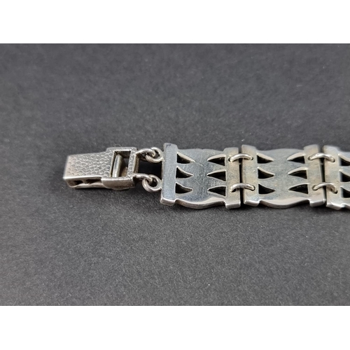 312 - A white metal and marcasite gate bracelet, stamped 925, approximately 18cm long; together with a sim... 