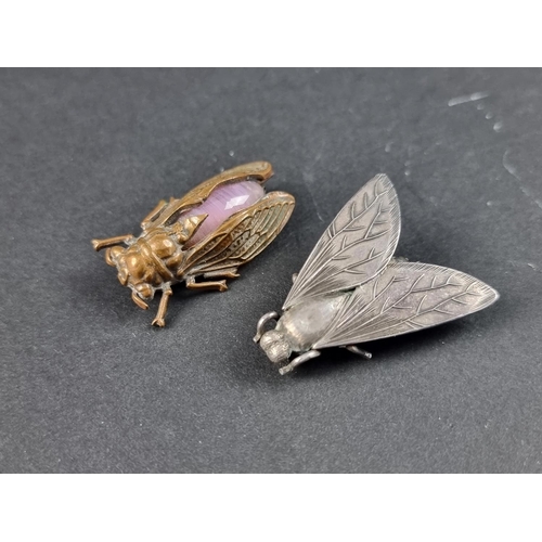 313 - A white metal 'fly' brooch, 3.5cm wide; together with another similar brass and semi-precious stone ... 