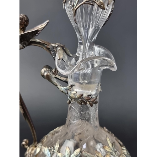 32 - A good pair of late 19th/early 20th century French silver mounted cut glass claret jugs, with .950 s... 