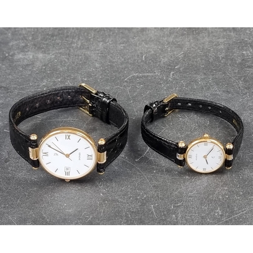 366 - A set of two similar Geneve 9ct gold quartz wristwatches, largest 32mm, both on black leather straps... 