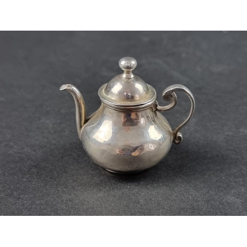 39 - A miniature Continental white metal novelty teapot, 5cm high.