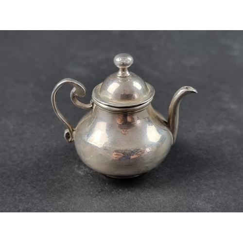 39 - A miniature Continental white metal novelty teapot, 5cm high.