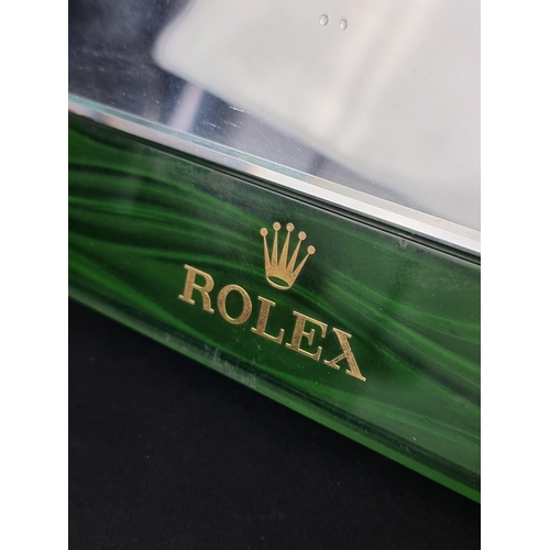 412 - A Rolex green leather and acrylic easel back retailer's mirror, 25cm.