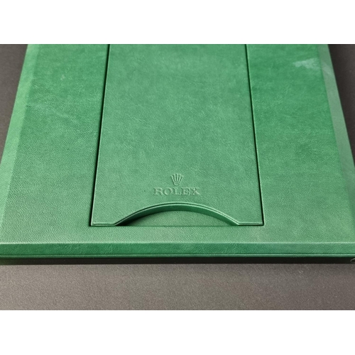 412 - A Rolex green leather and acrylic easel back retailer's mirror, 25cm.