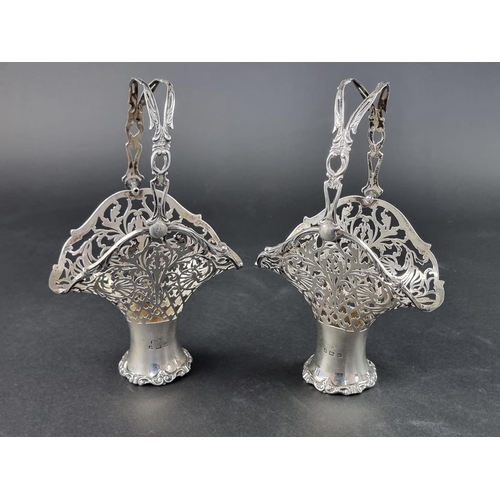 43 - A pair of silver baskets, by Henry Matthews, Birmingham 1912, height to handle 19cm, 262g.... 