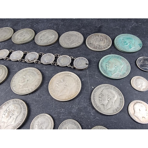 437 - Coins: a quantity of UK silver and part silver coinage, mostly George V and George VI, gross weight ... 