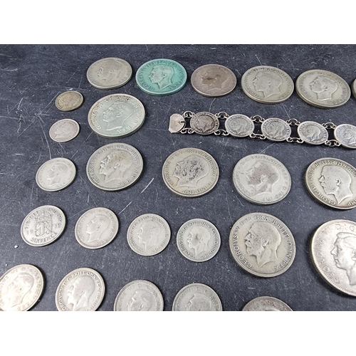 437 - Coins: a quantity of UK silver and part silver coinage, mostly George V and George VI, gross weight ... 