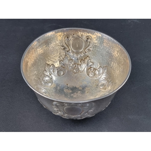 44 - An Edwardian hammered silver bowl, by Searle & Co, London 1909, 11.5cm diameter, 176g.... 