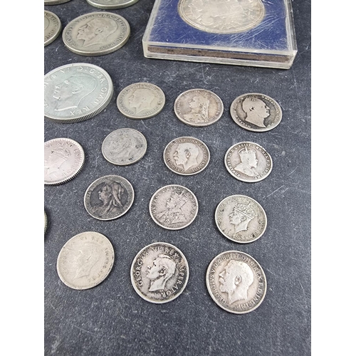 440 - Coins: a small quantity of UK, India and other silver and part silver coinage, mostly George V, to i... 