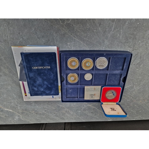 459 - Coins: an Elizabeth II 1977 Silver Jubilee silver proof crown, with CoA, cased; together with a Guer... 