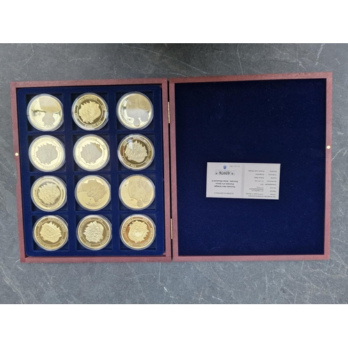 474 - Coins: five Windsor Mint gold plated coin collections; to include 'Monarchy of Queen Elizabeth II' a... 