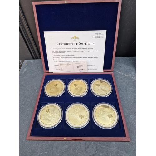 475 - Coins: four Windsor Mint gold plated coin collections; to include an Elizabeth II commemorative set ... 